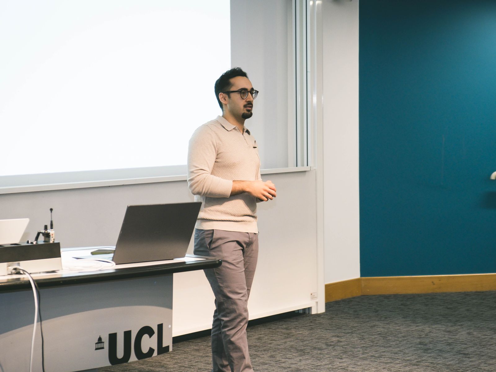 A speaker presenting at BUCA, photographed by Kyros