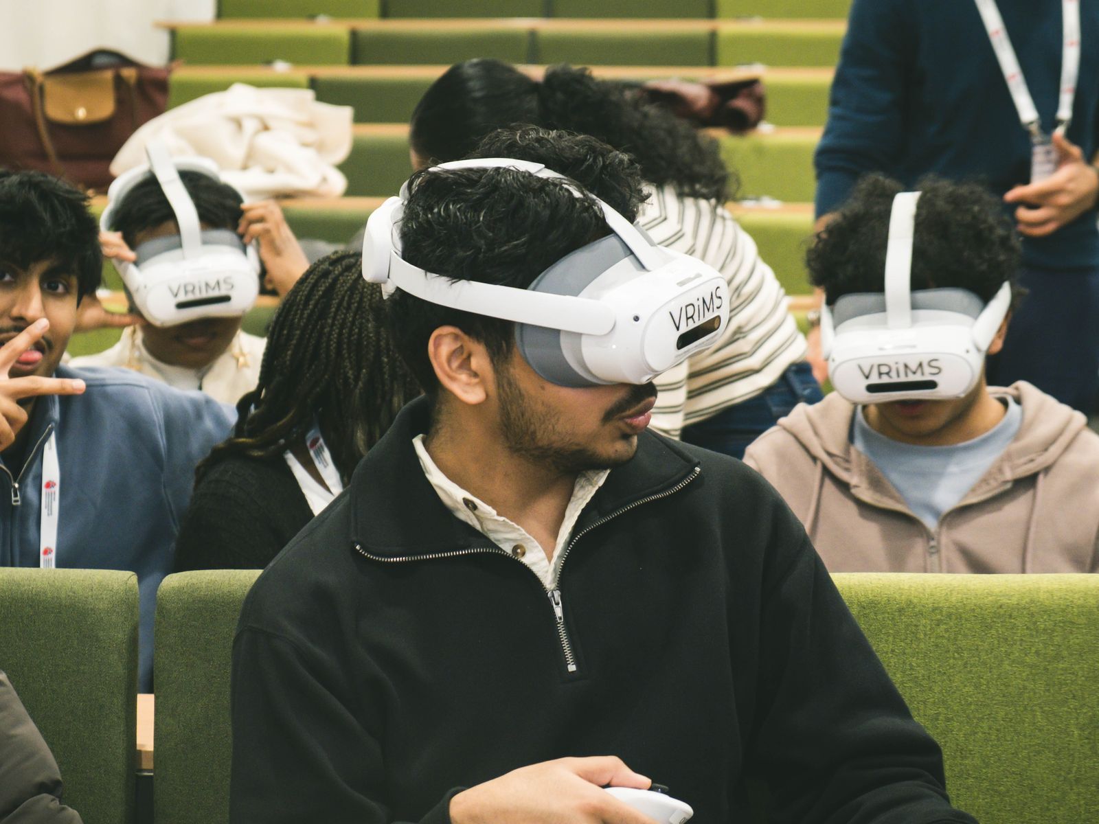 Delegates trying VR headsets at BUCA, photographed by Kyros