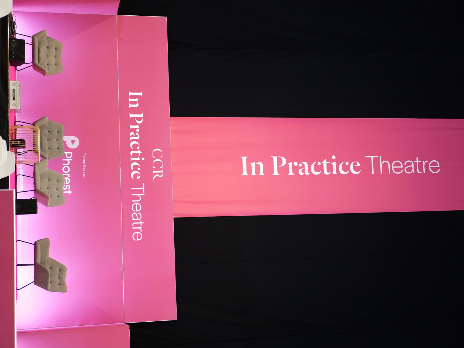 The CCR In Practice Theatre set and sponsor branding, photographed by Kyros